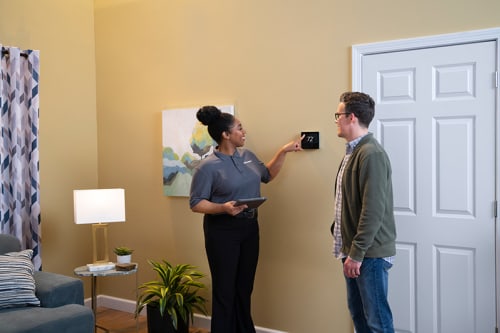 airquest-dealer-telling-homeowner-about-brand-reliability