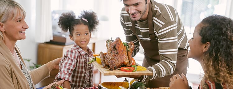 family-enjoying-turkey-dinner family-enjoying-turkey-dinner