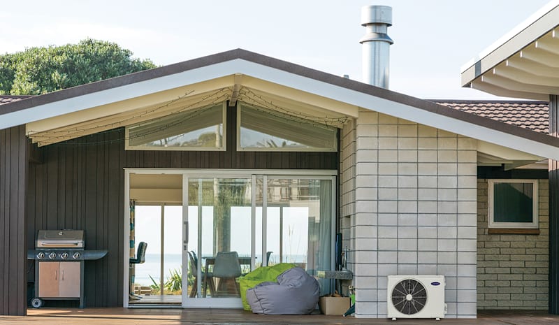 a ductless mini split in a backyard showing what is a mini split