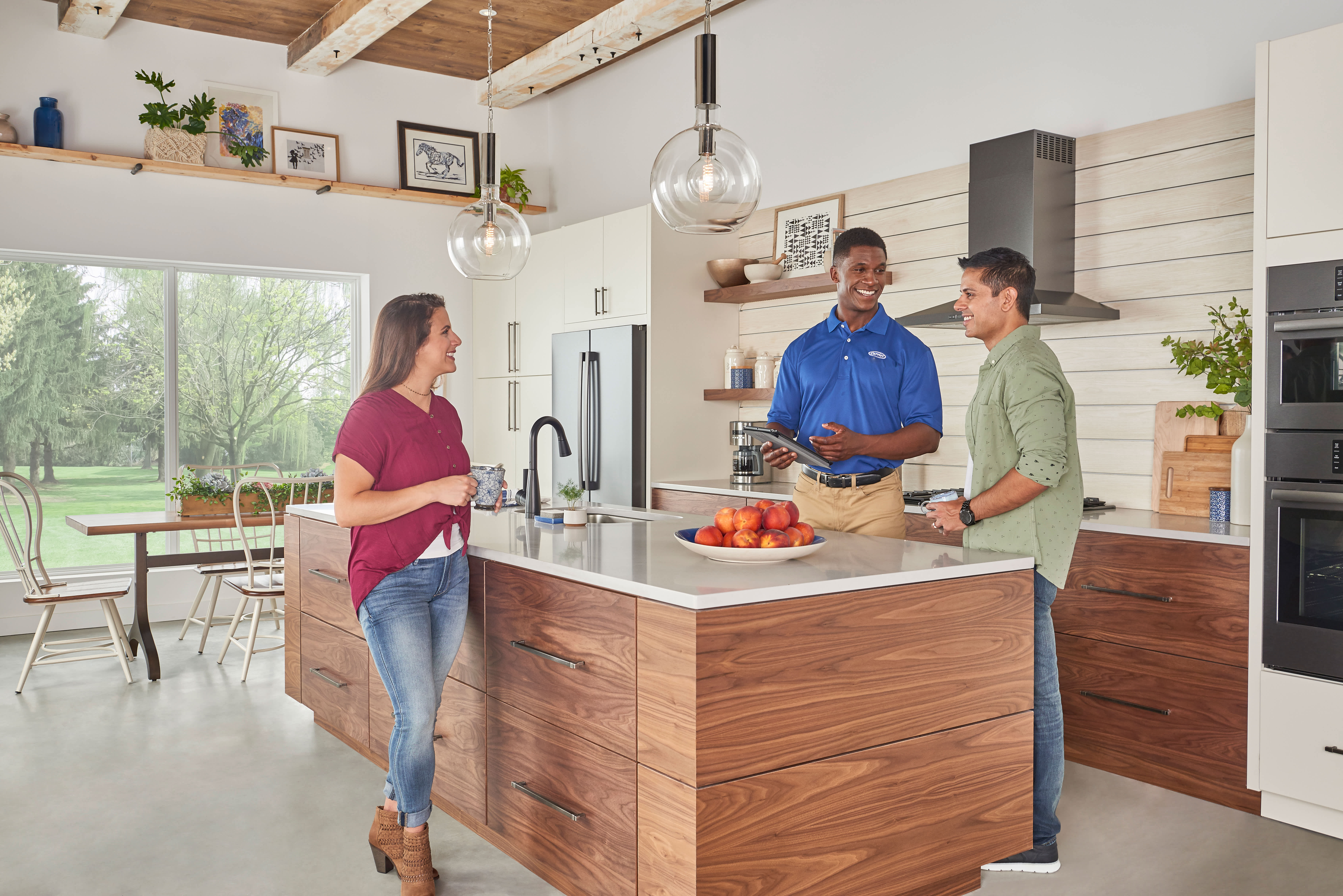 Air conditioning consultation with a homeowner reviewing HVAC system options