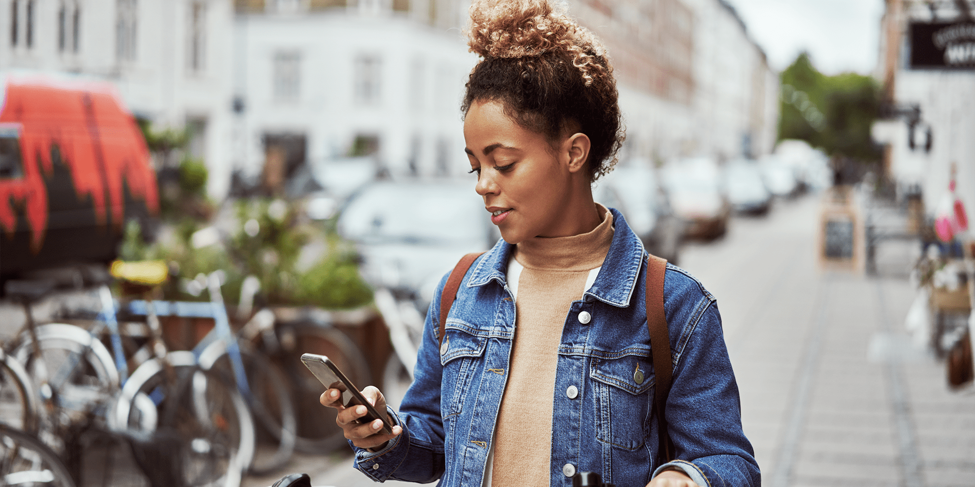 woman-on-bicycle-with-phone-outside