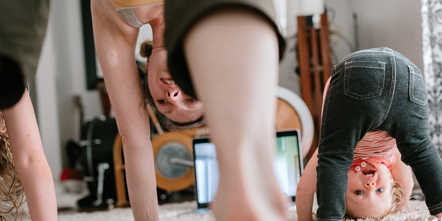 mom-and-kids-do-head-stands-on-carpet-3x2