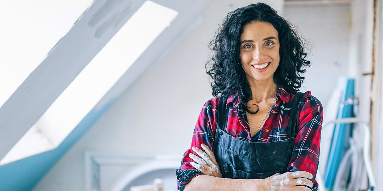 woman-in-loft-with-plaid-shirt-maintaining-home-3x2