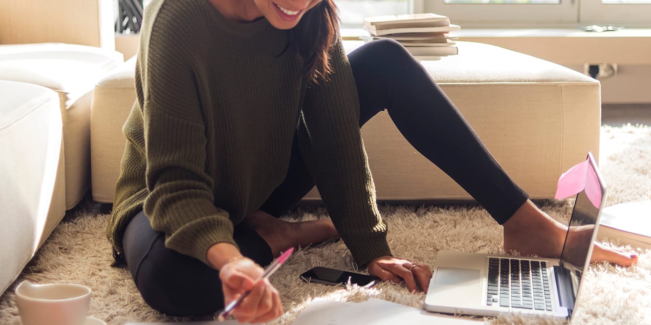 woman-in-sunlight-on-floor-with-papers-3x2
