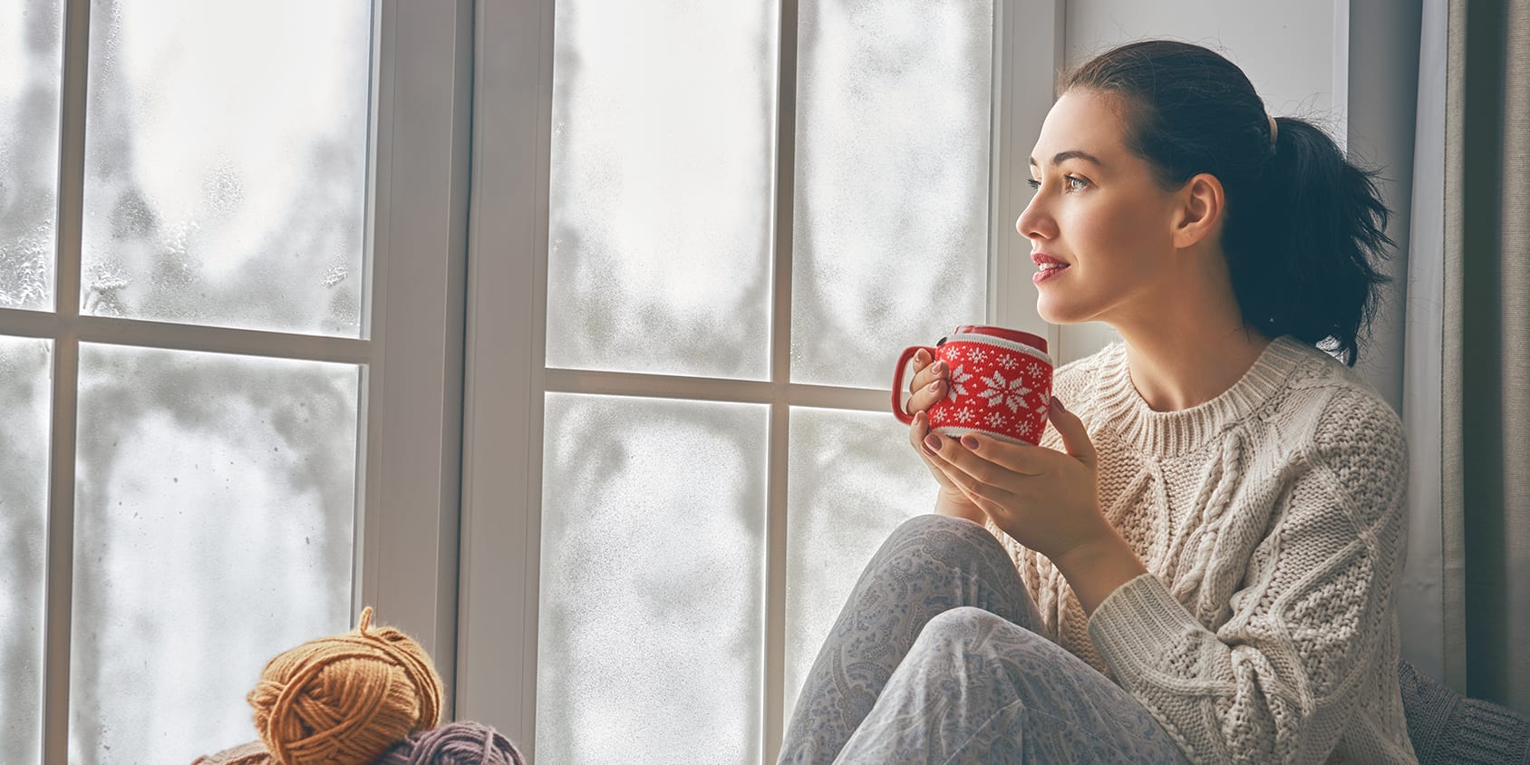 woman-with-yarn-near-window-3x2