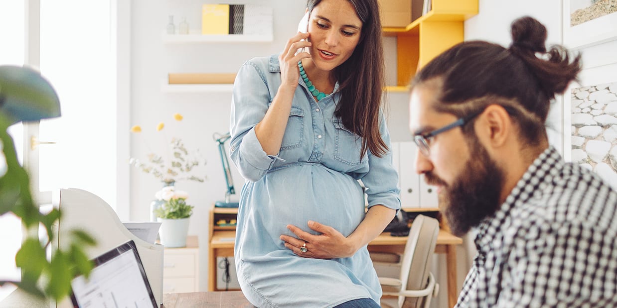 man-and-woman-research-online-at-desk-3x2