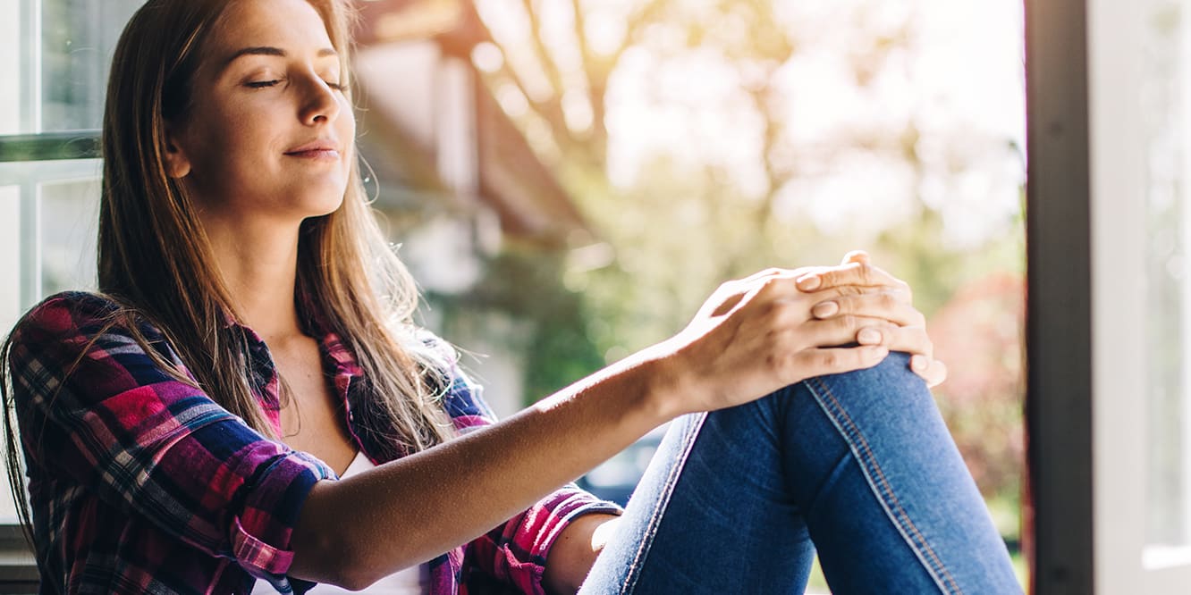 woman-in-window-breathing-in-clean-air-3x2