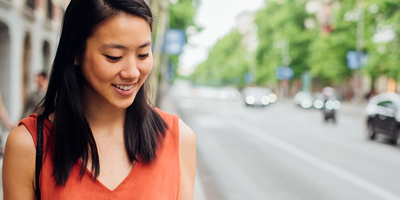 woman-mobile-phone-street-smart-thermostat-3x2