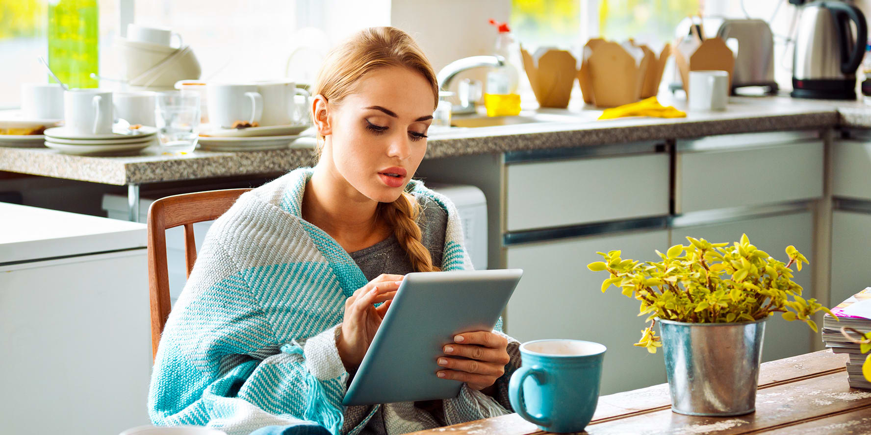 woman-on-tablet-at-table-with-shawl