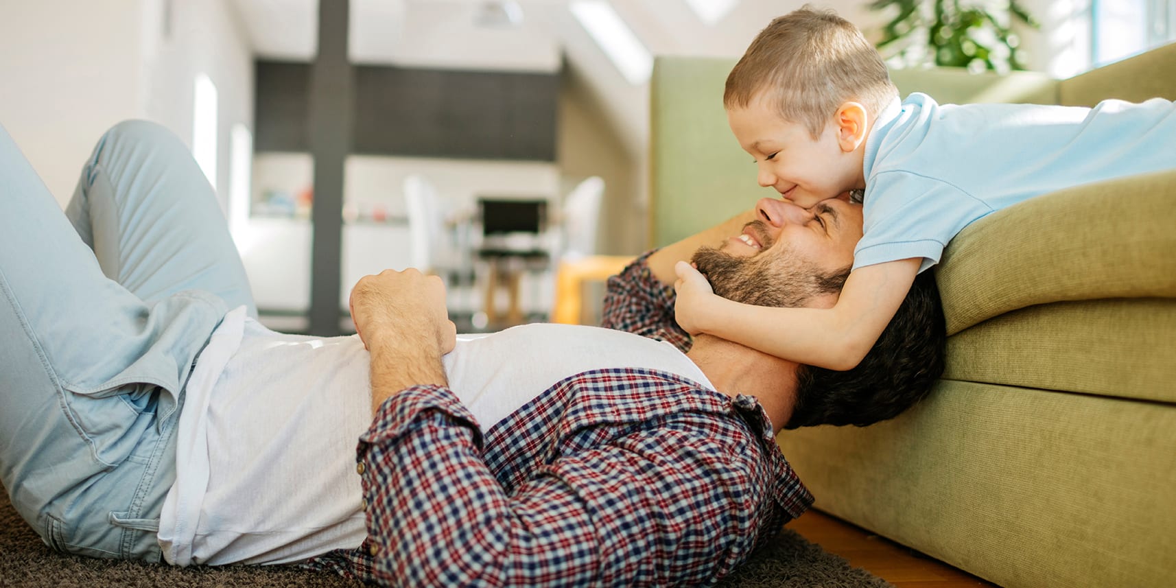 father-son-playing-by-sofa-3x2