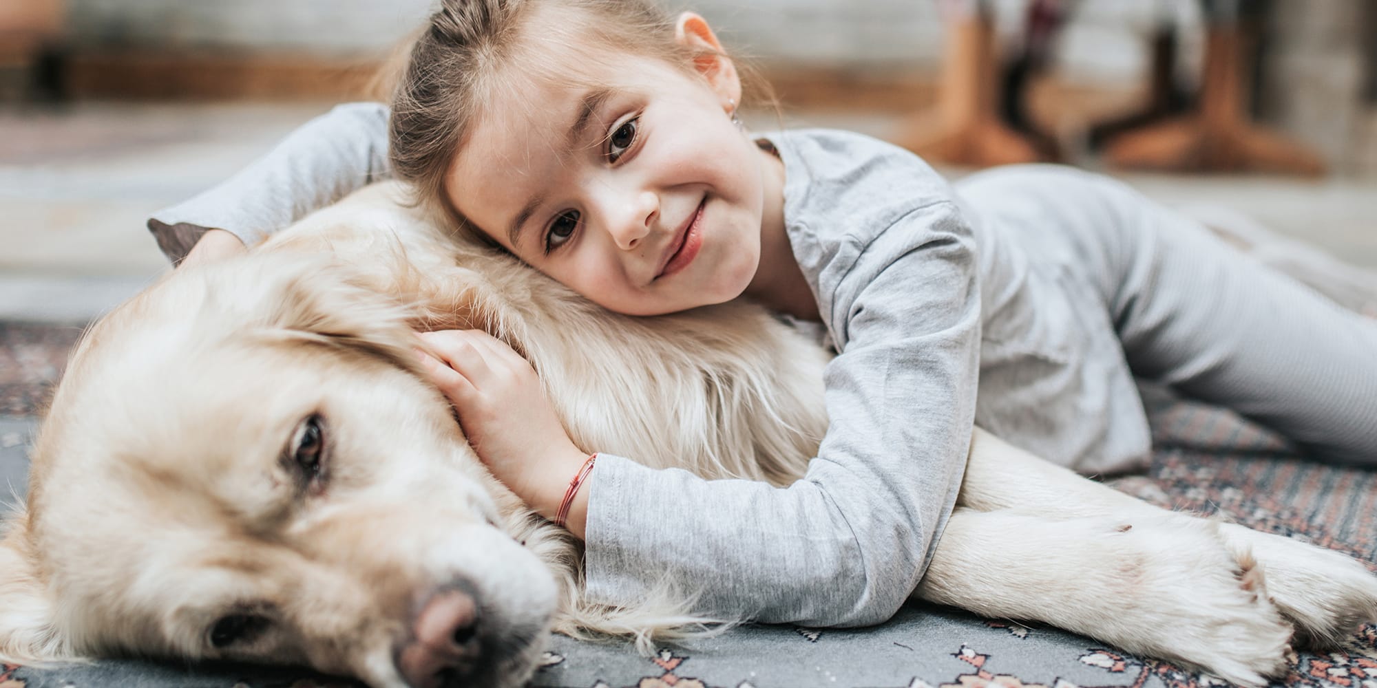 girl-with-dog-on-floor-3x2
