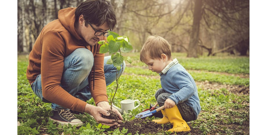 father-and-son-planting-a-tree-after-scheduling-air-conditioner-service