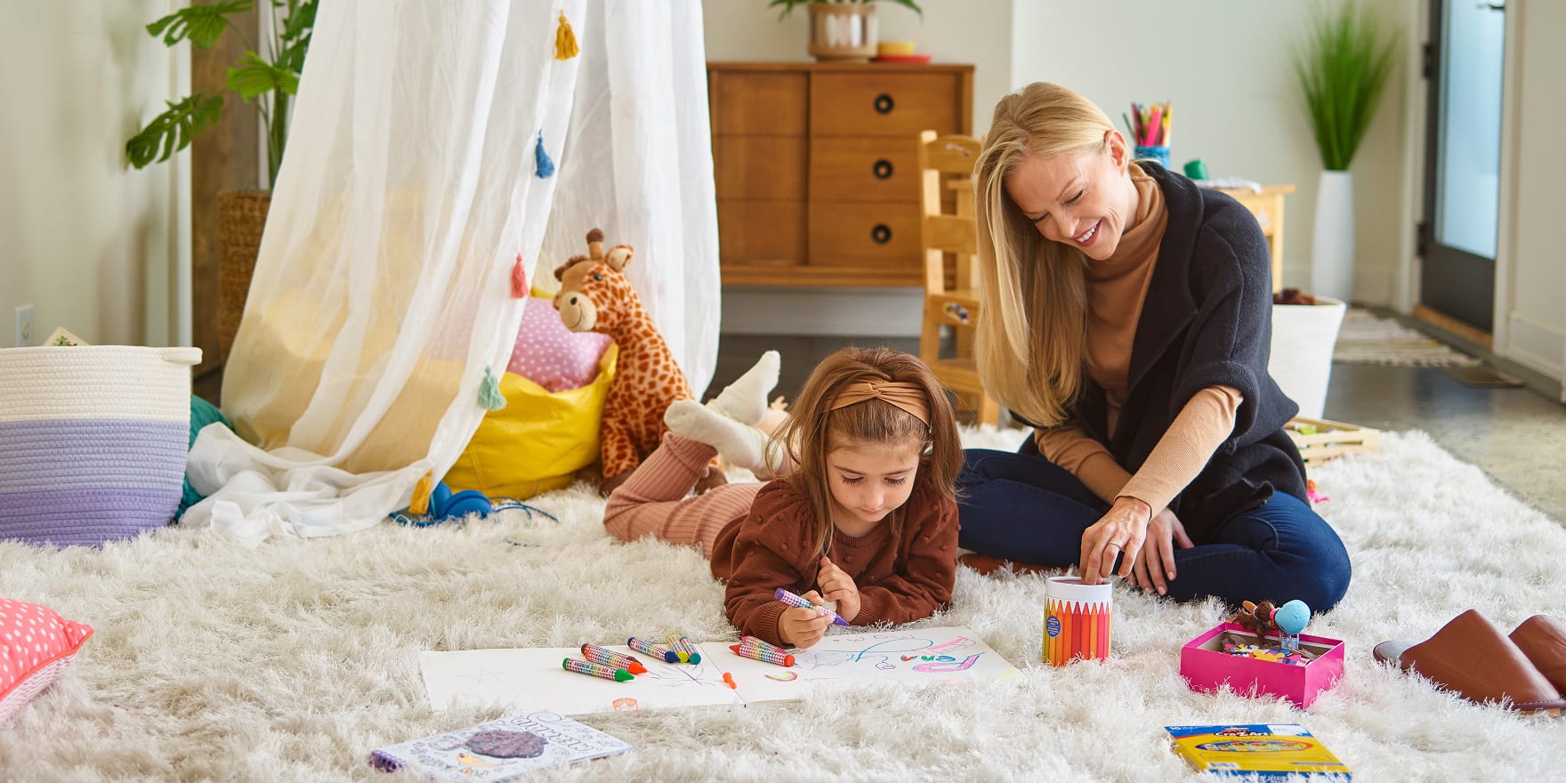 a-mother-and-daughter-drawing-pictures-while-enjoying-heat-pump-comfort
