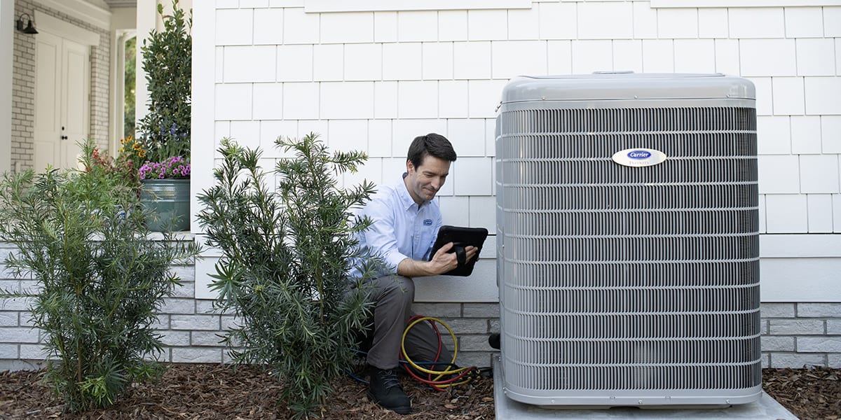 carrier-technician-conducting-an-air-conditioner-coil-cleaning