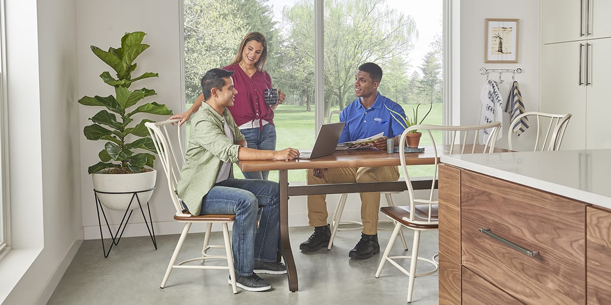 a-carrier-dealer-discusses-the-advantages-of-a-furnace-tuneup-with-a-couple