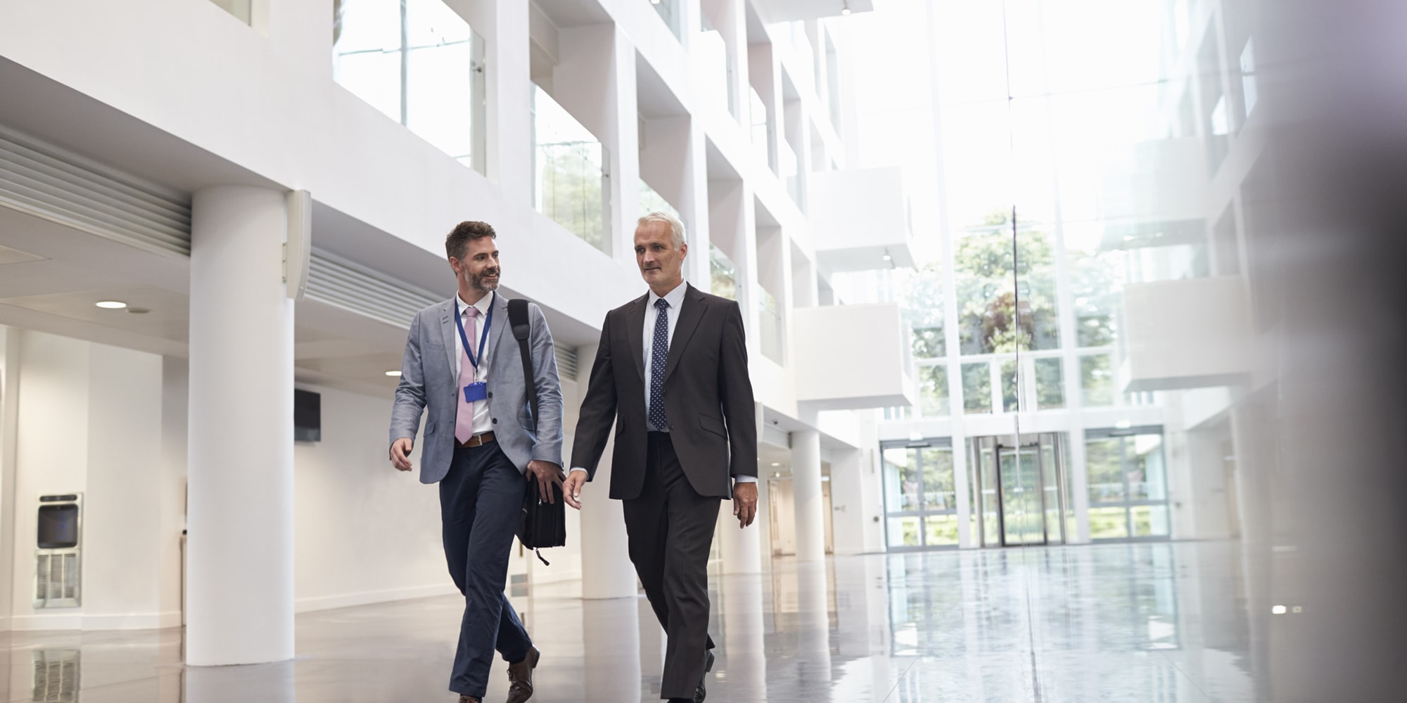 carrier-two-men-walking-in-building-lobby
