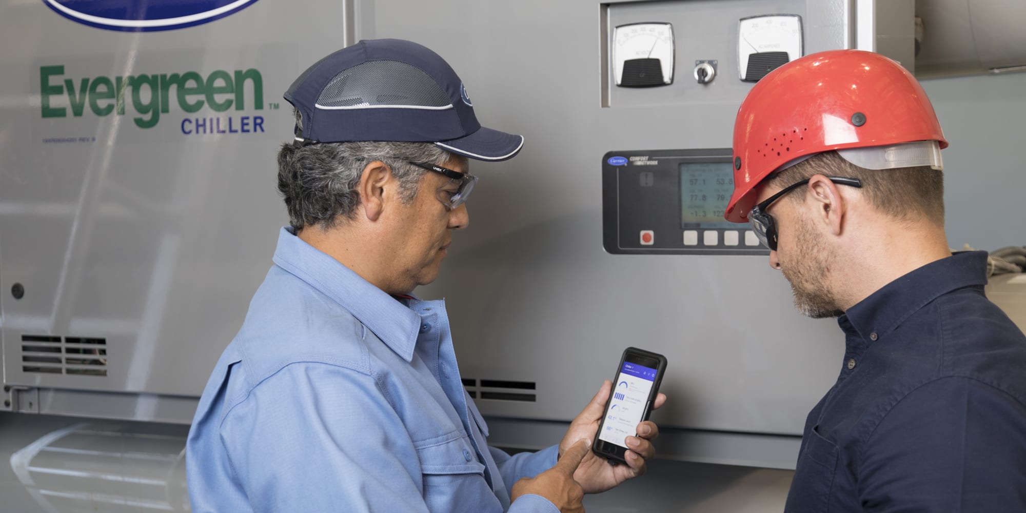 carrier-service-technicians-looking-at-mobile-phone