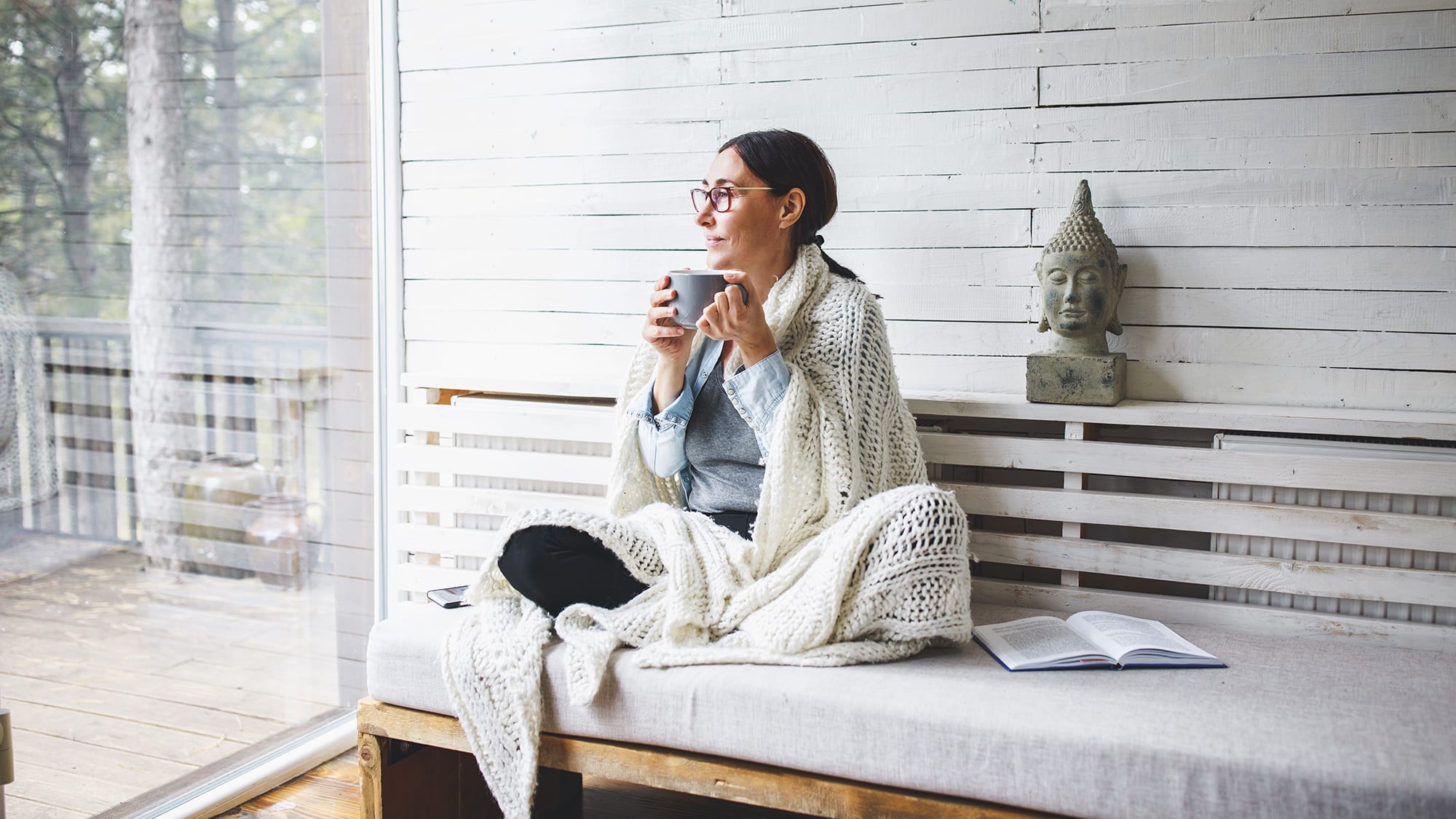 peaceful-woman-sitting-on-bench-outdoors-with-mug peaceful-woman-sitting-on-bench-outdoors-with-mug
