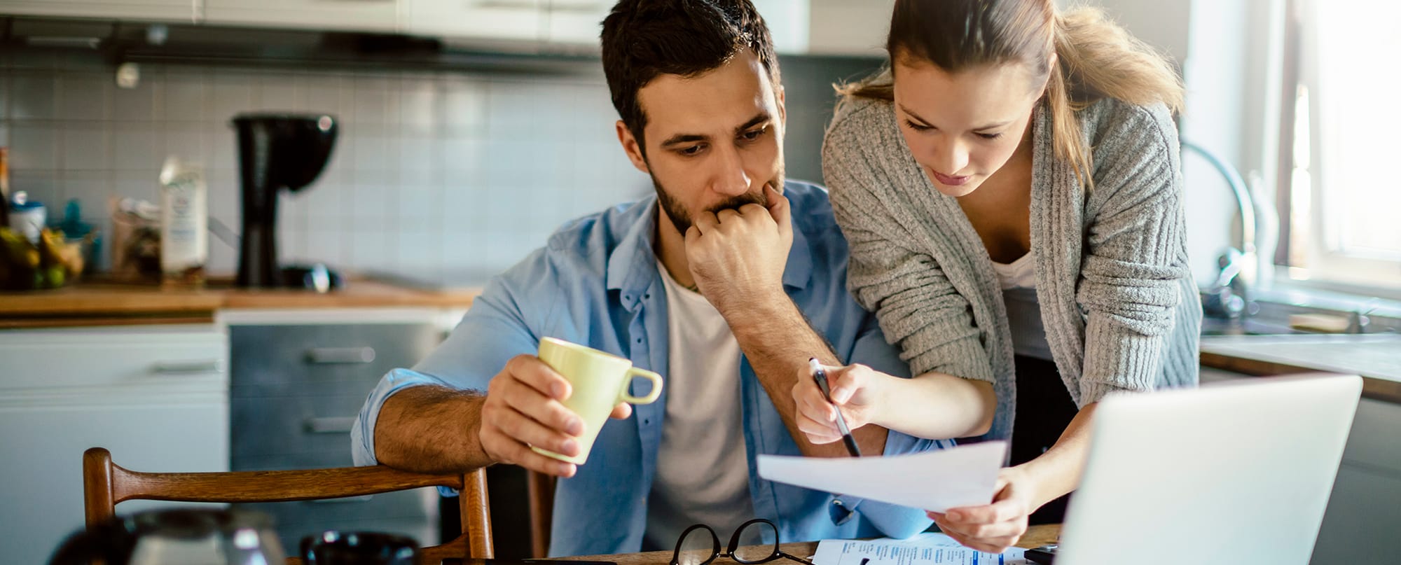 gas-furnace-for-your-budget Couple reviewing documents about gas furnace for your budget