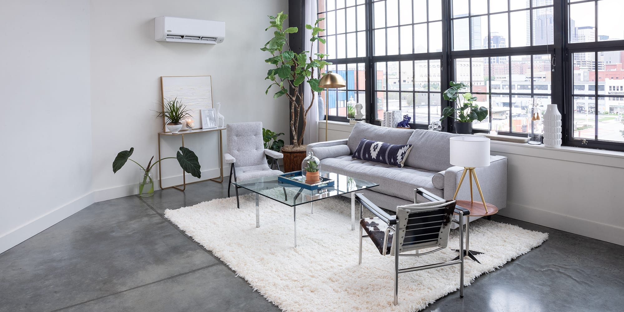 A spacious room with a ductless mini split system not blowing cold air. A spacious room with a ductless mini split system not blowing cold air.