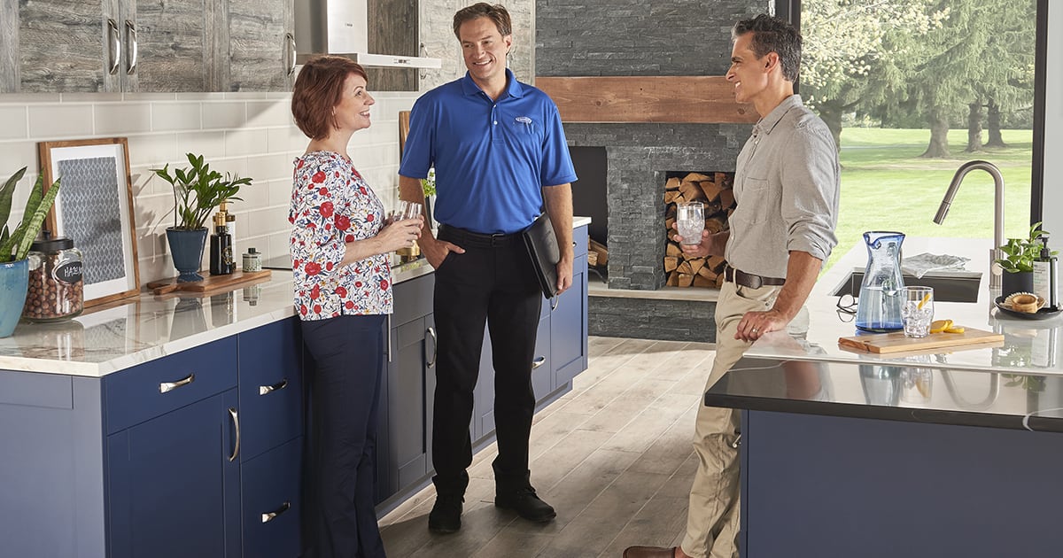 a carrier dealer discusses best air purifier for dust removal options with a couple a carrier dealer discusses best air purifier for dust removal options with a couple