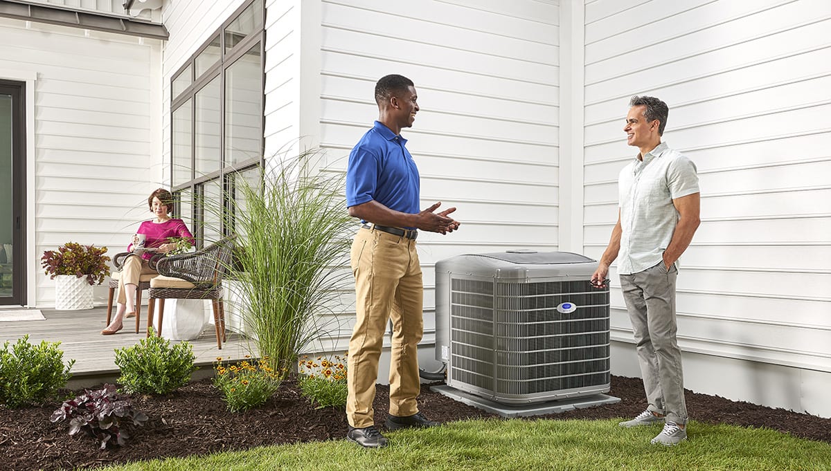 a carrier dealer tells a homeowner about energy efficiency ratio