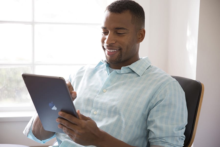 a man researches furnace installation near me on his tablet a man researches furnace installation near me on his tablet