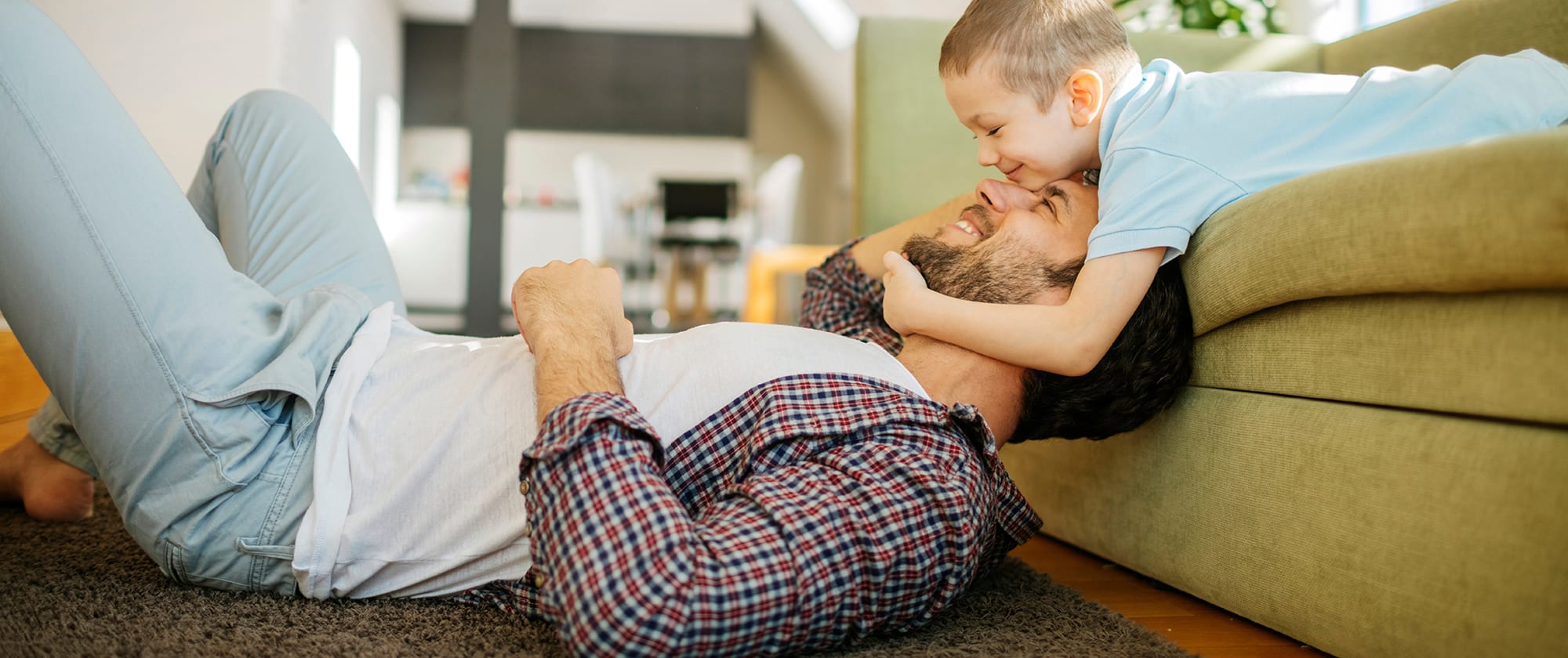 a father and son play after their air conditioning service is completed by an ac company near me A father and son play after their air conditioning service was finished.