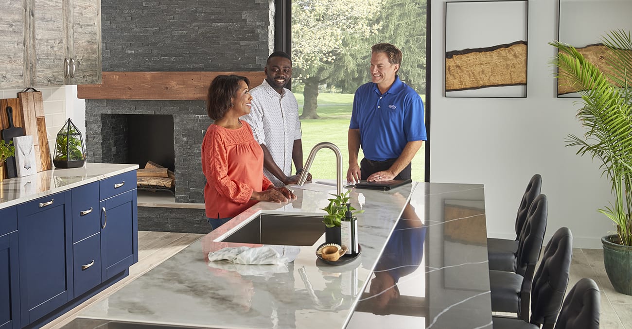 a carrier dealer talks to a homeowner about the benefits of a whole home humidifier for house a carrier dealer talks to a homeowner about the benefits of a whole home humidifier for house