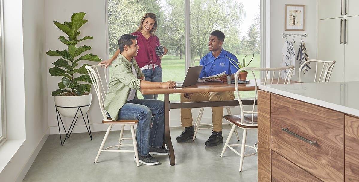 a couple discusses air conditioner filter replacement best practices with a carrier dealer a couple discusses air conditioner filter replacement best practices with a carrier dealer