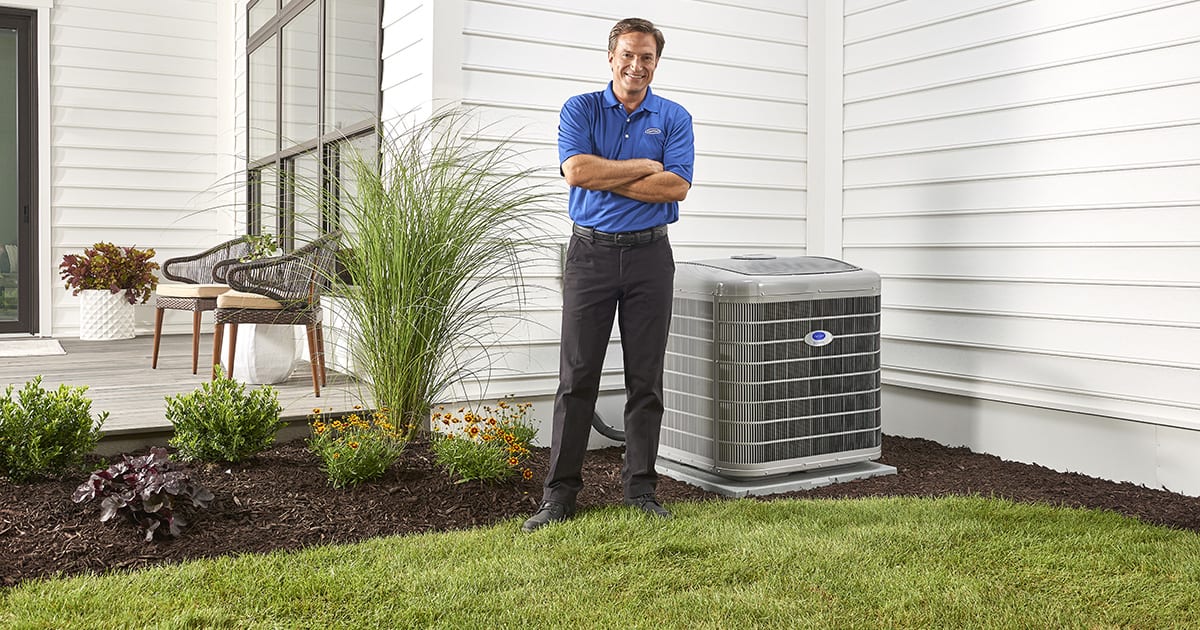 carrier dealer stands next to air conditioner after fixing ac not turning on carrier dealer stands next to air conditioner after fixing ac not turning on