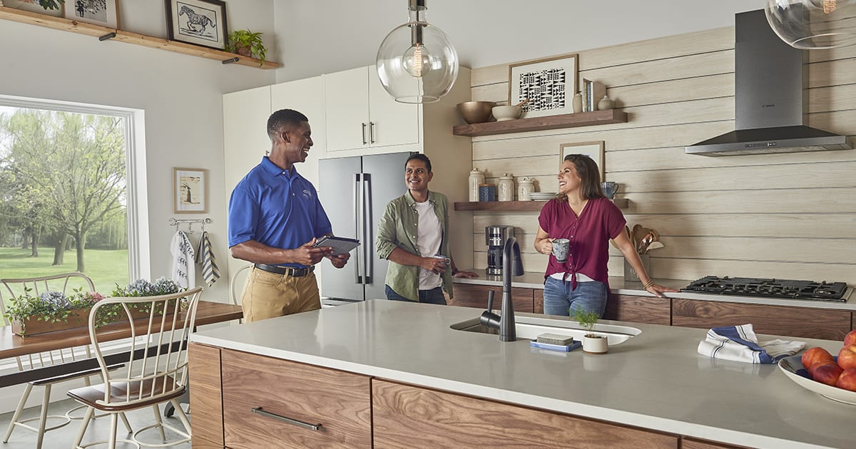 a carrier dealer discusses electric furnace benefits with homeowners a carrier dealer discusses electric furnace benefits with homeowners