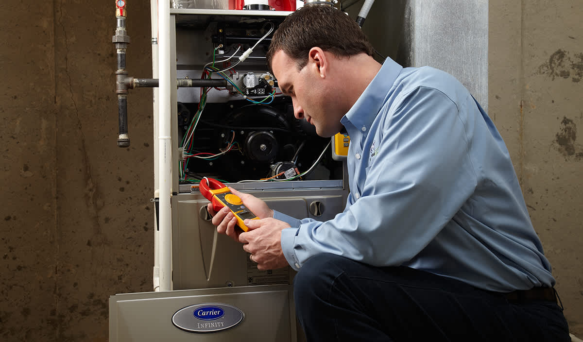 a carrier dealer inspects furnace parts a carrier dealer inspects furnace parts