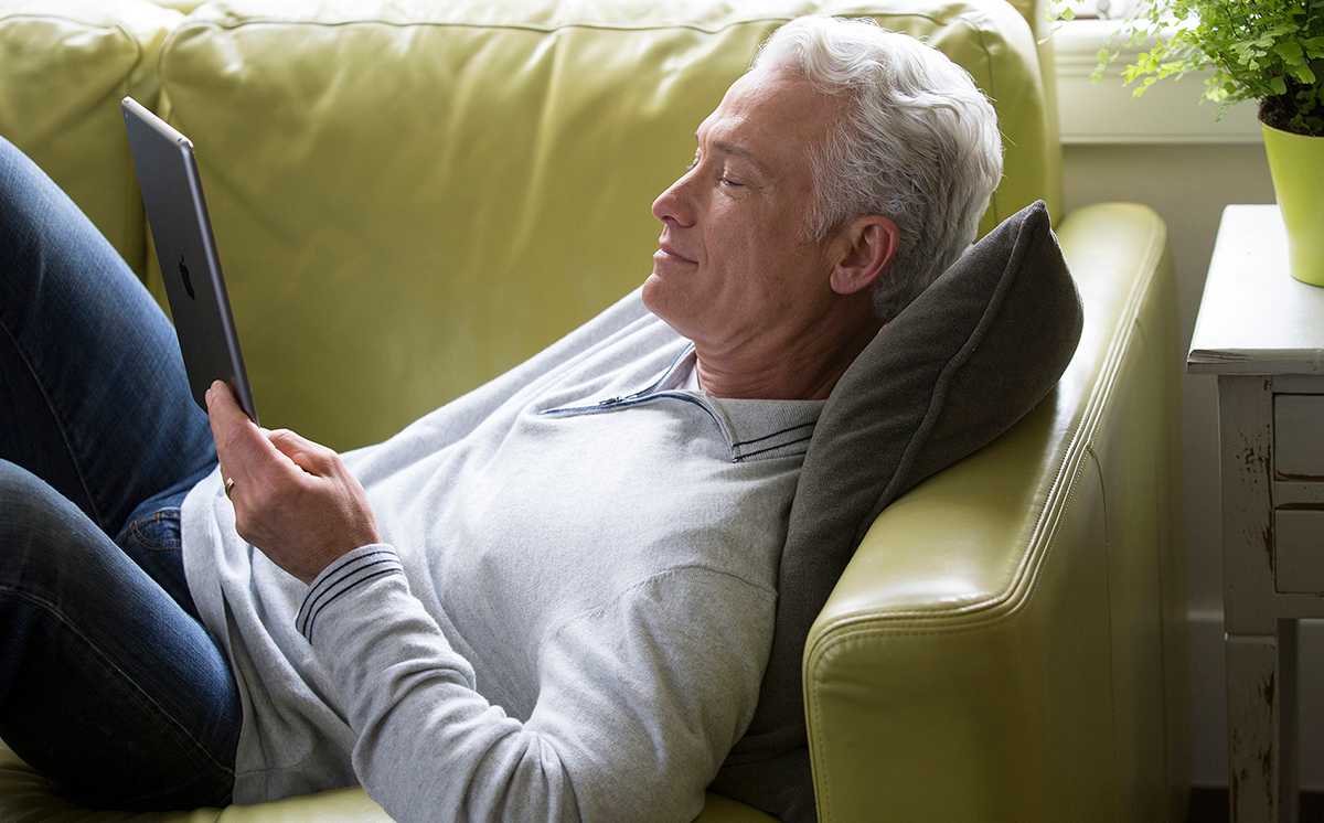 a man researches how does a dehumidifier work on his tablet