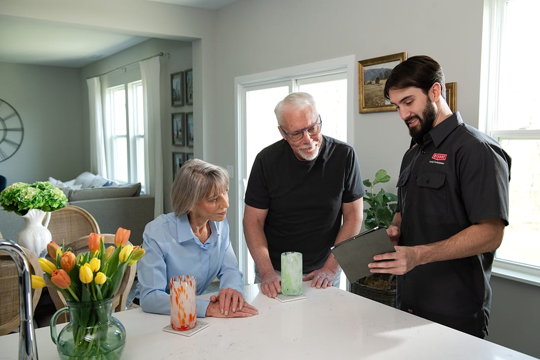 a bryant dealer discusses types of air conditioners with homeowner a bryant dealer discusses types of air conditioners with homeowner