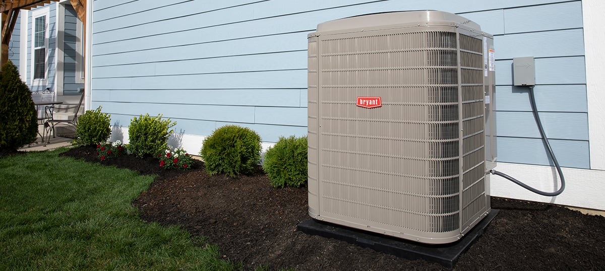 5 ton ac unit sits outside blue home 5 ton ac unit sits outside blue home