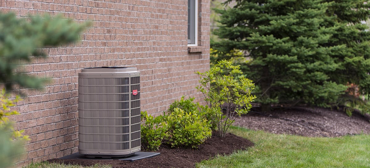 a 4 ton ac unit sits on the side of a home a 4 ton ac unit sits on the side of a home