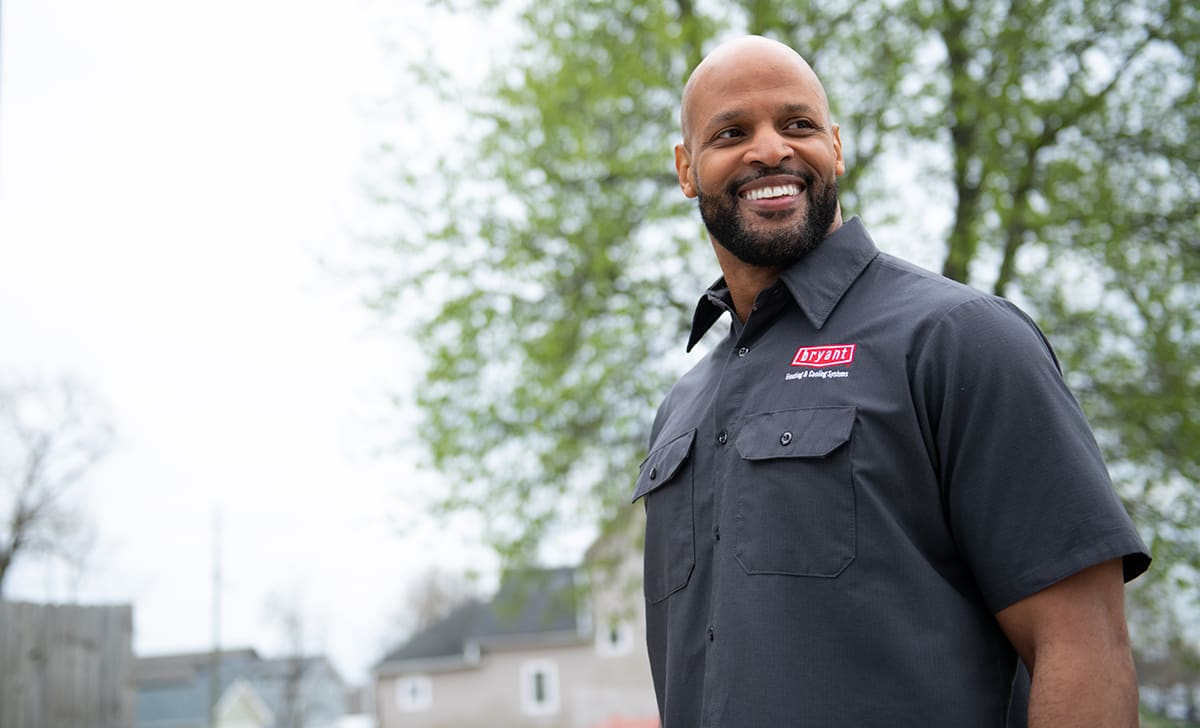 a bryant dealer smiles after air conditioner service a bryant dealer smiles after air conditioner service
