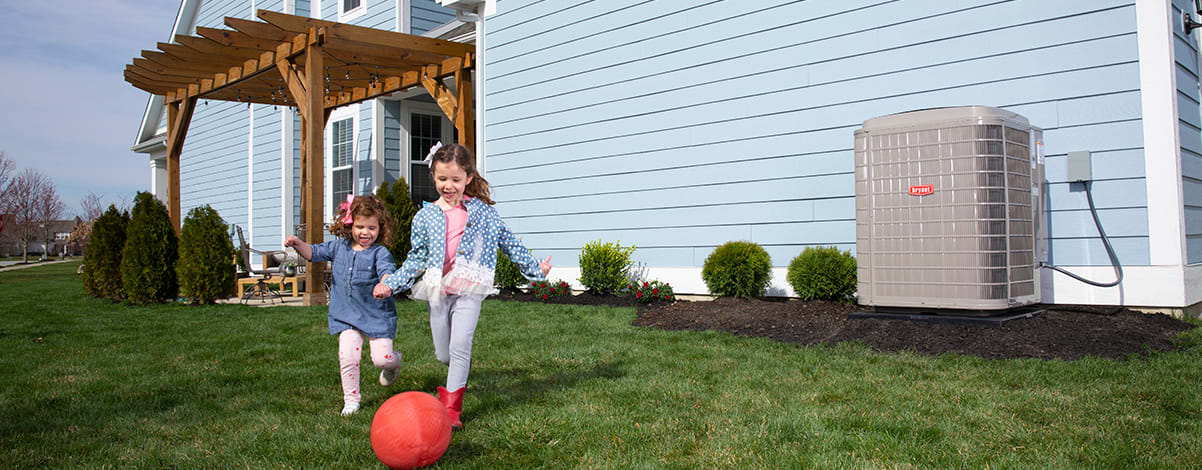 kids play in backyard by high efficiency heat pump kids play in backyard by high efficiency heat pump