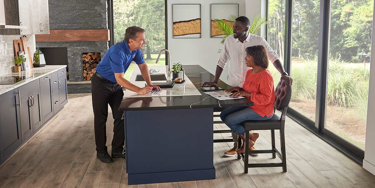 a carrier dealer discusses with homeowners what hvac system qualifies for tax credit