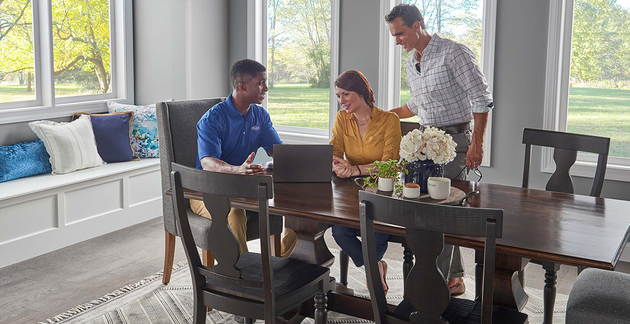 a carrier dealer discusses air handler repair options with homeowner a carrier dealer discusses air handler repair options with homeowner