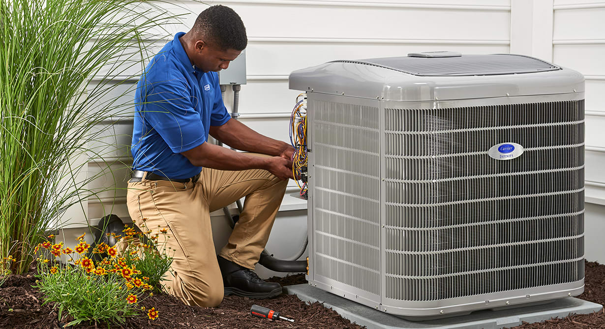 a carrier dealer works on a 4 ton heat pump a carrier dealer works on a 4 ton heat pump