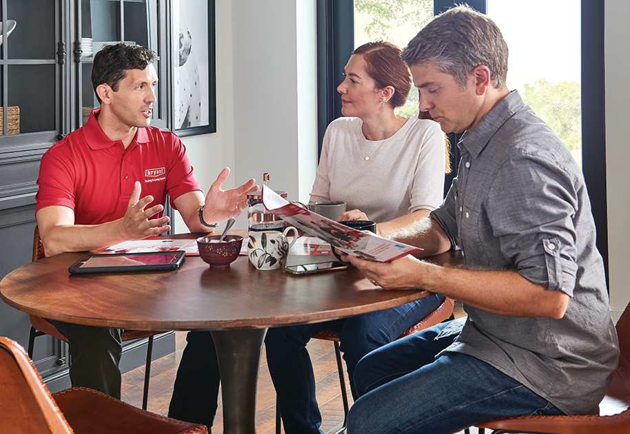 a bryant dealer discusses whole house humidifier types with homeowners a