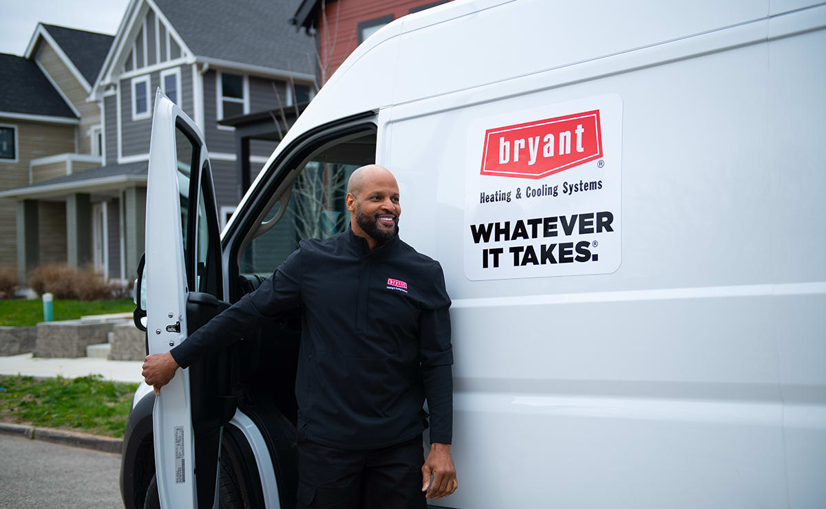 bryant dealer steps out of van for 2-ton heat pump installation