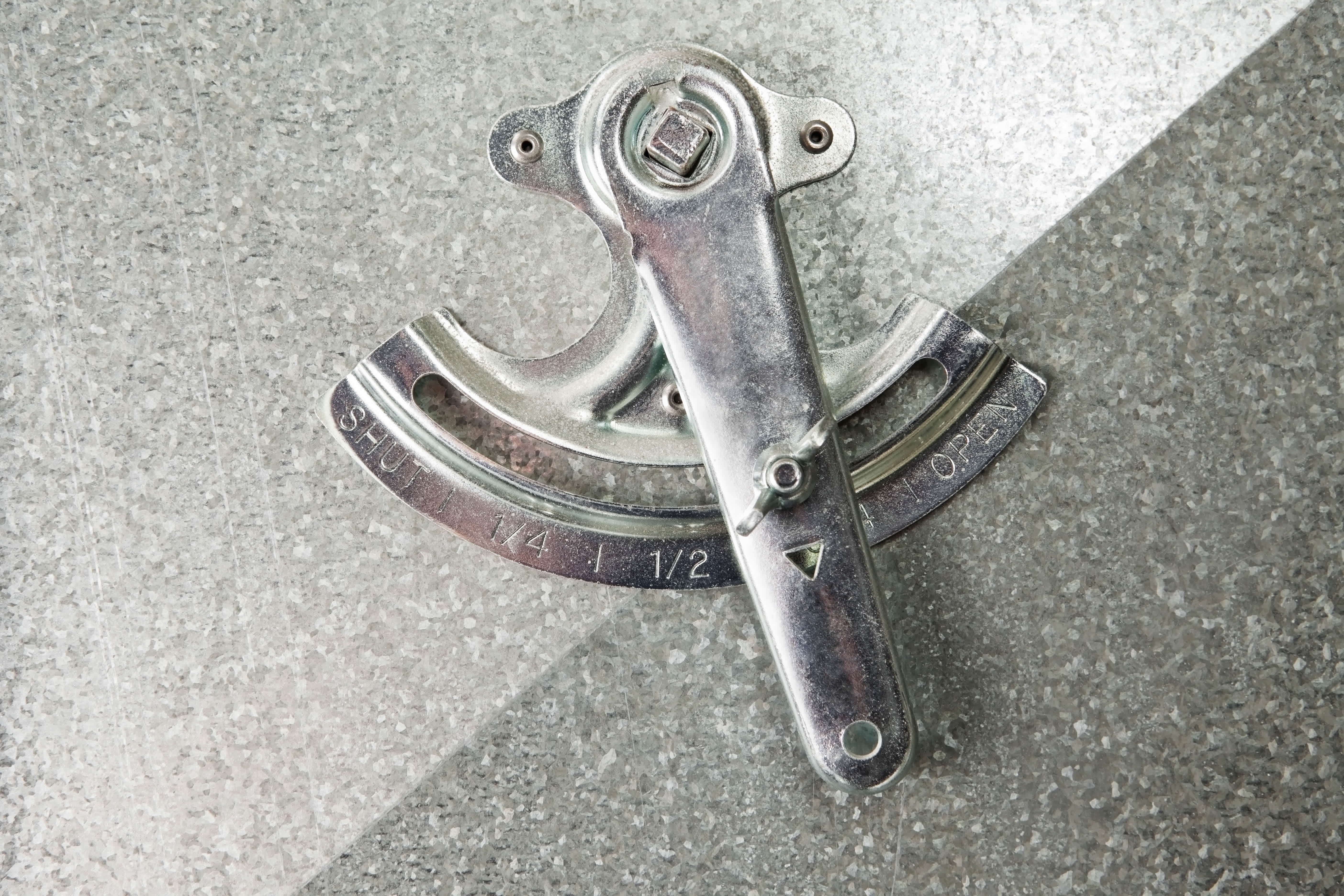 an hvac damper sitting on an hvac duct