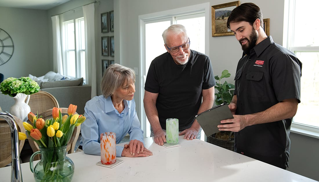 bryant dealer and homeowner discuss whole home hvac ventilator installation options