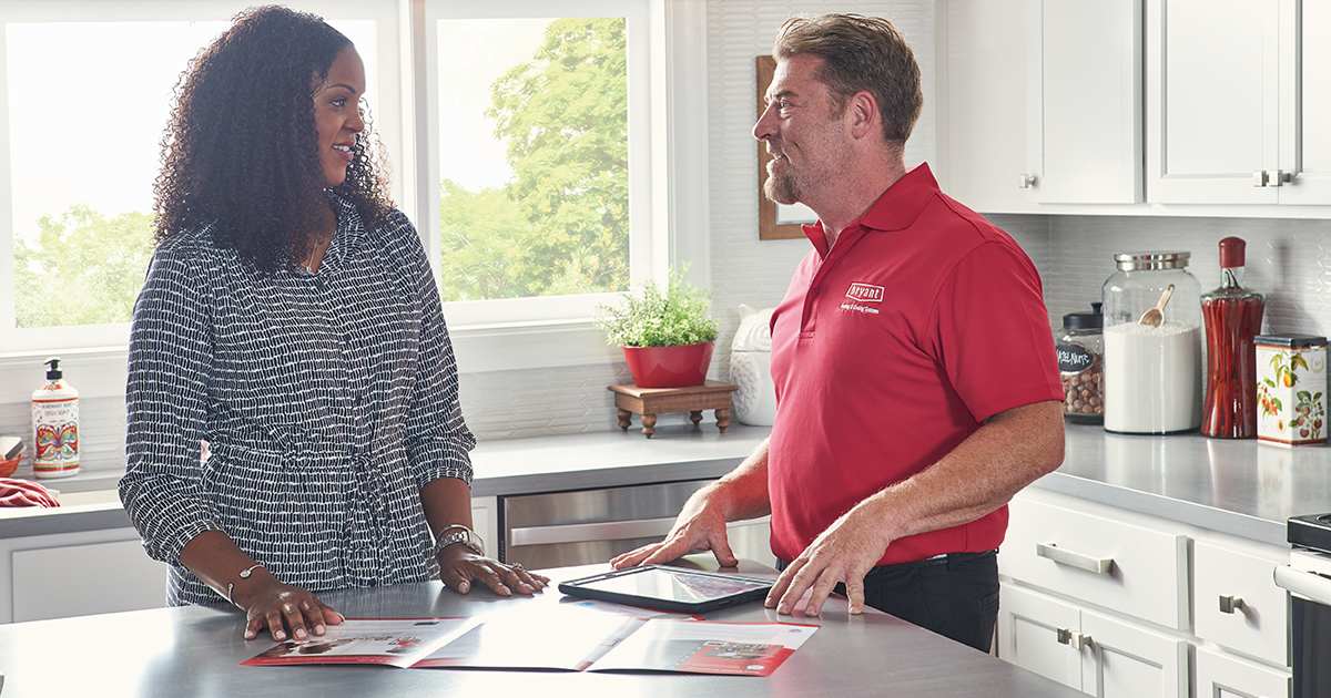 bryant dealer walks through 2.5 ton ac unit options with homeowner