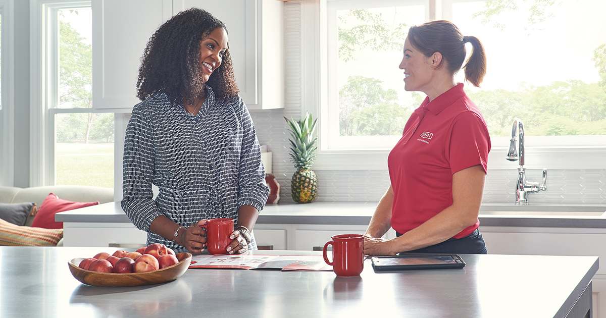 a bryant dealer discusses furnace blower motor options with homeowner