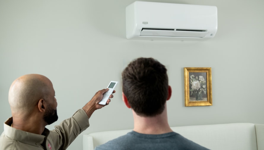 a bryant dealer shows a homeowner how 4 zone mini split operates