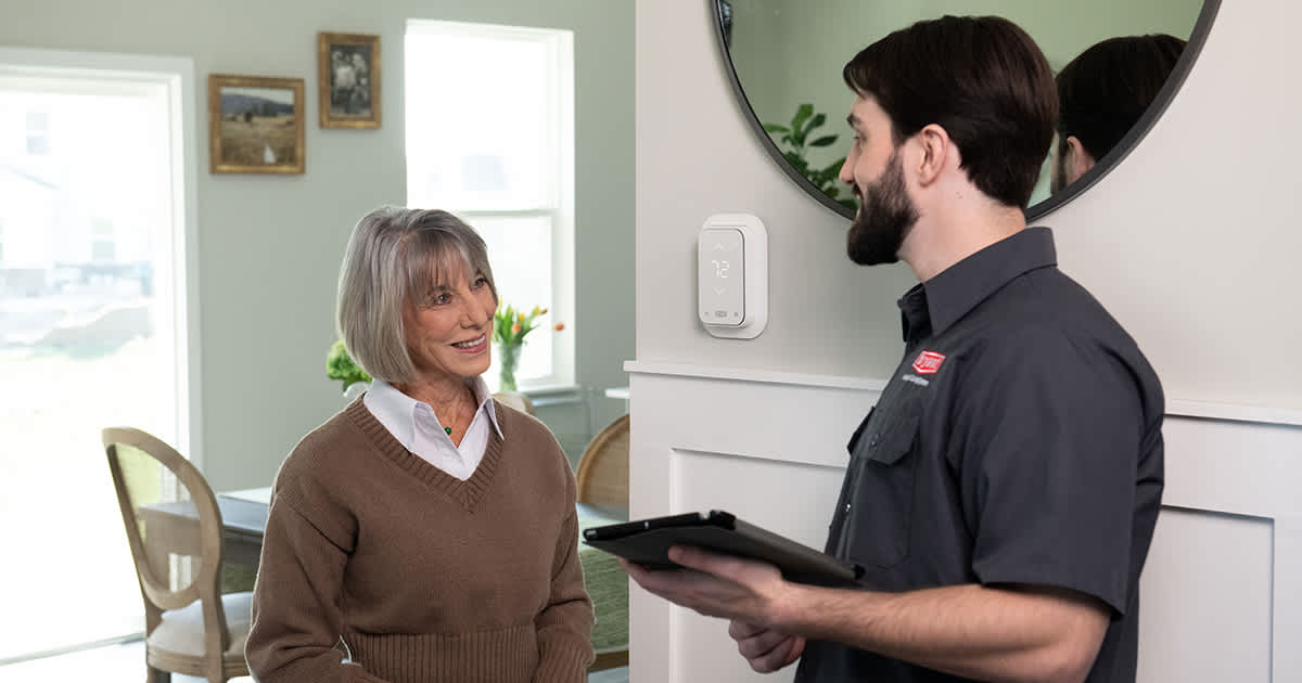 a homeowner discusses hspf2 rating with bryant dealer